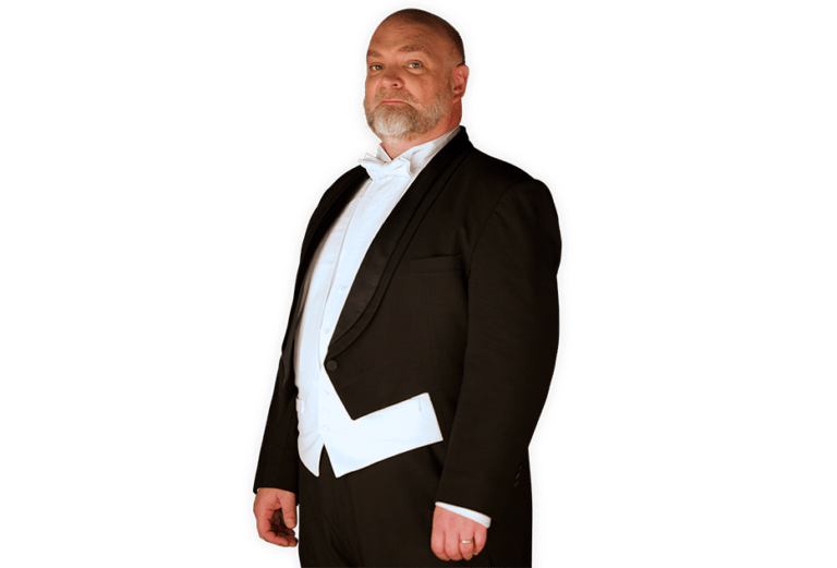 The Conductor wearing a full tuxedo with coattails