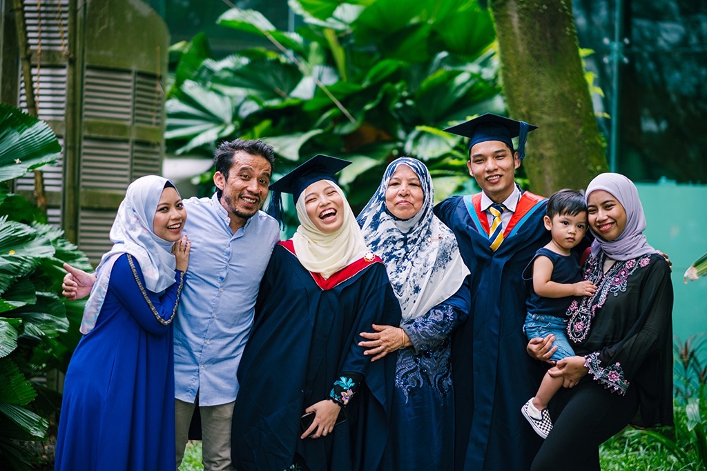 a multigenerational family celebrates a college graduation