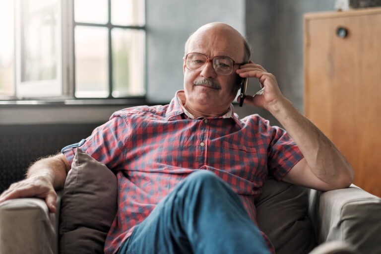 Man on phone negotiating with creditors