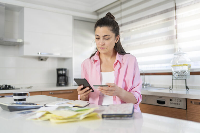 Woman looking at collection notices