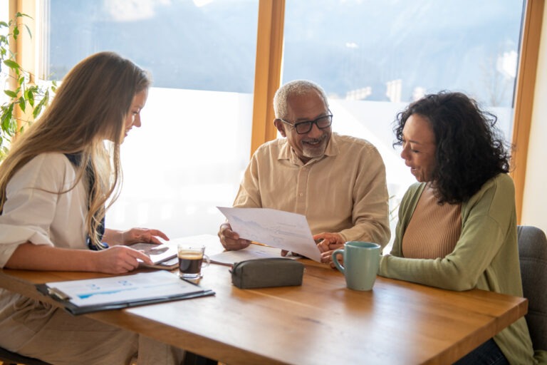 Life settlement agent going over details with life insurance policy holders