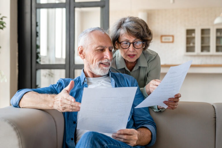 Couple looking at debt report