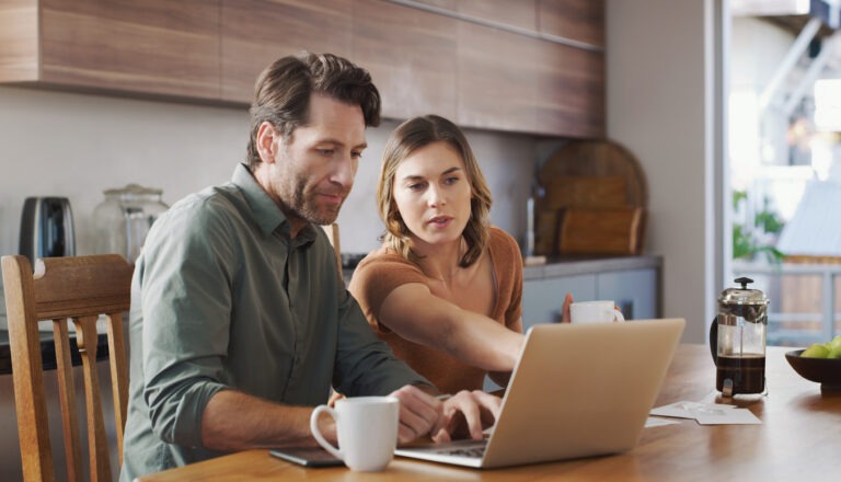 Couple working through their debt management plan (DMP)