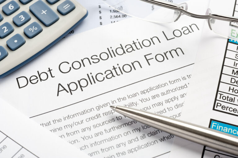 Debt Consolidation Loan Application Form with pen, calculator