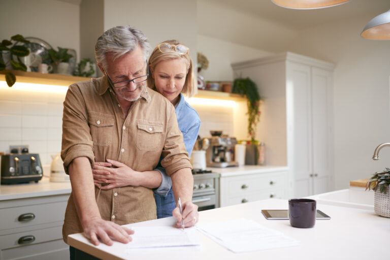 Older couple looking at what to do with term life insurance policy