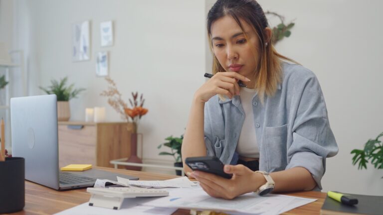 Woman checking bank account to check for possible wage garnishment