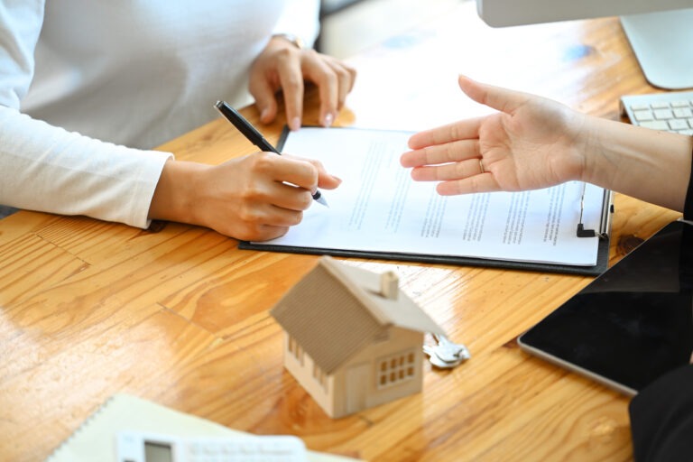 Woman signing a home equity contract