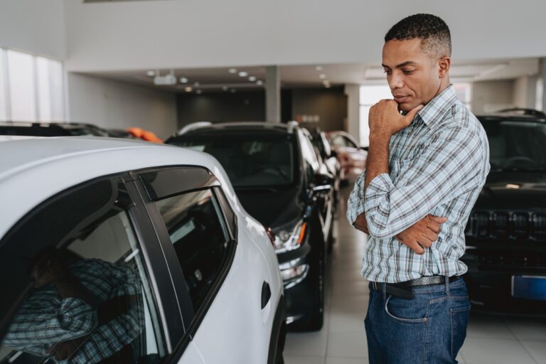 Man analyzing car to buy