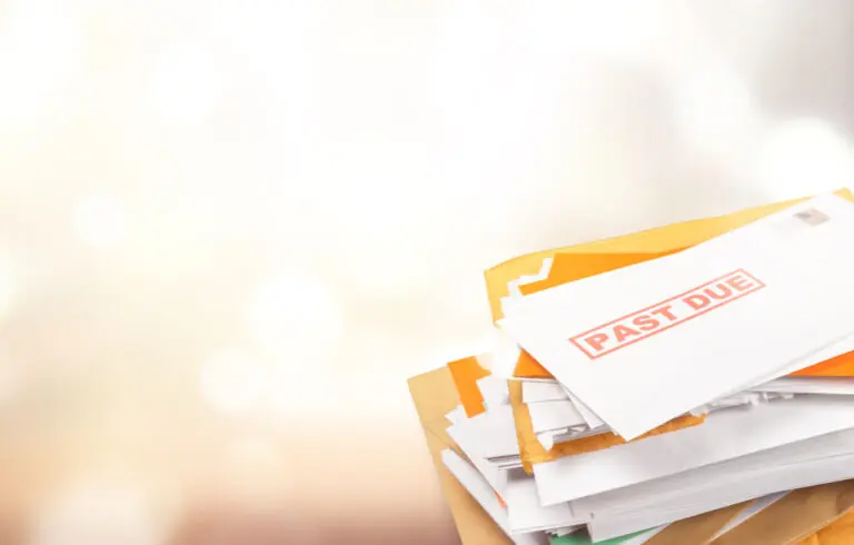 Pile of envelopes with overdue utility bills isolated on white